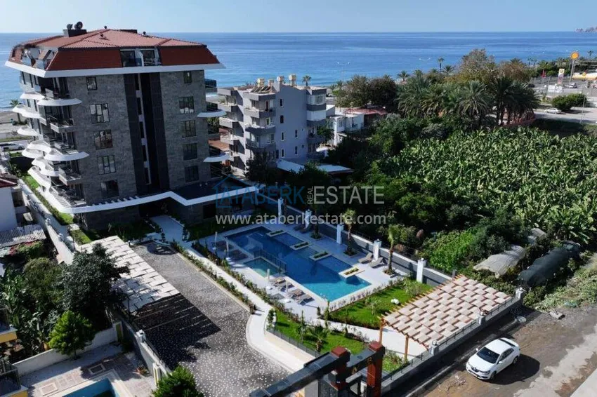 1+1 apartment overlooking the sea and the fortress on the beachfront in Kestel 7 