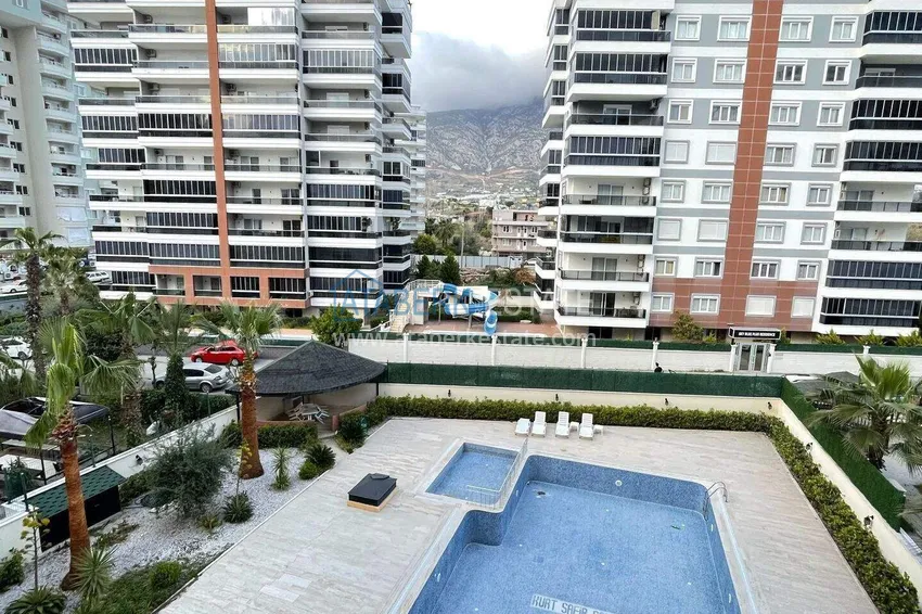 Purchase  2+1 apartment in Mahmutlar with furniture, a separate kitchen and a glazed balcony  17 
