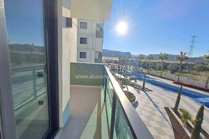 Purchase 1+1 apartment with appliances in Gazipasa - south side, residence with infrastructure 10 