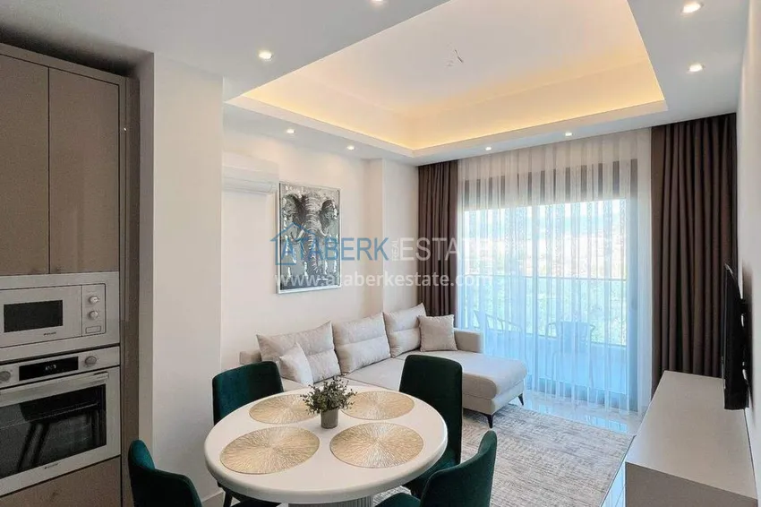 Purchase  1+1 apartment for rent in Mahmutlar — furnished and with views of the A40 mountains 1 