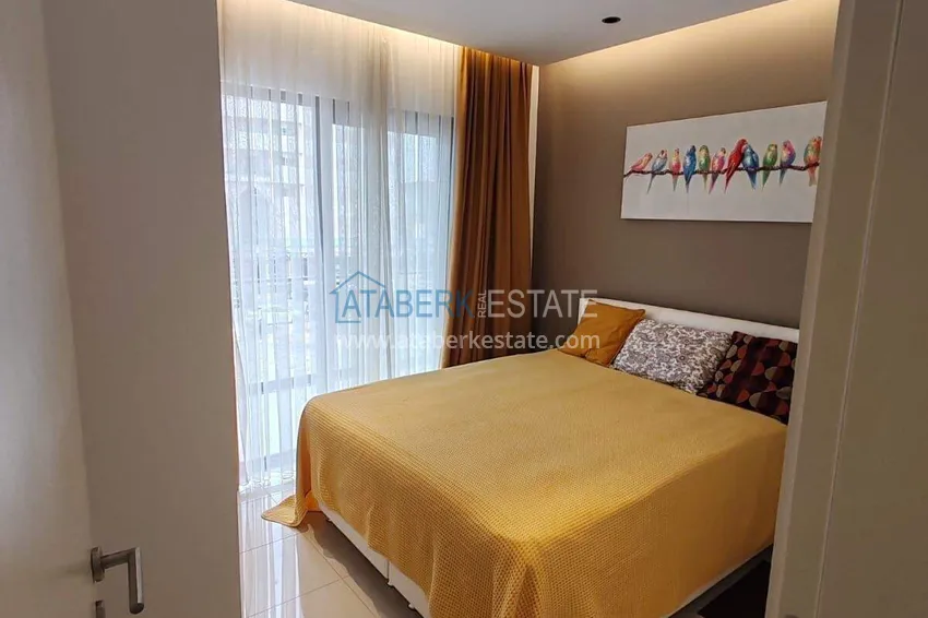 Purchase  1+1 apartment with sea view in the Oba area - first line, furnished, suitable for a residence permit 10 