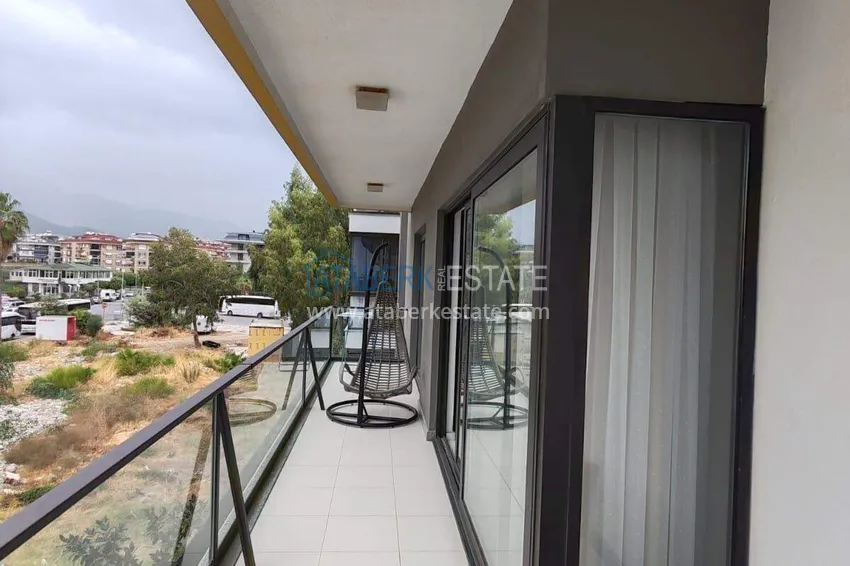 Purchase  1+1 apartment with sea view in the Oba area - first line, furnished, suitable for a residence permit 16 