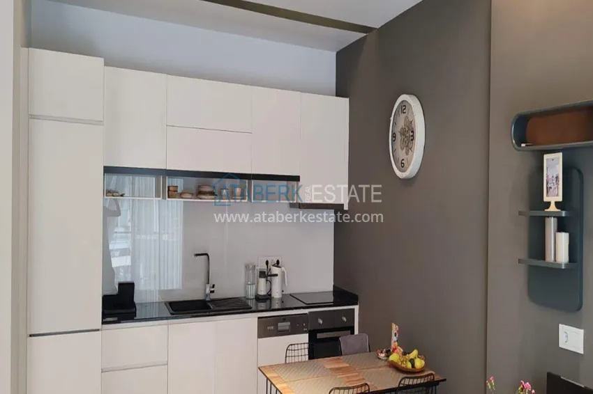 Purchase  1+1 apartment with sea view in the Oba area - first line, furnished, suitable for a residence permit 5 