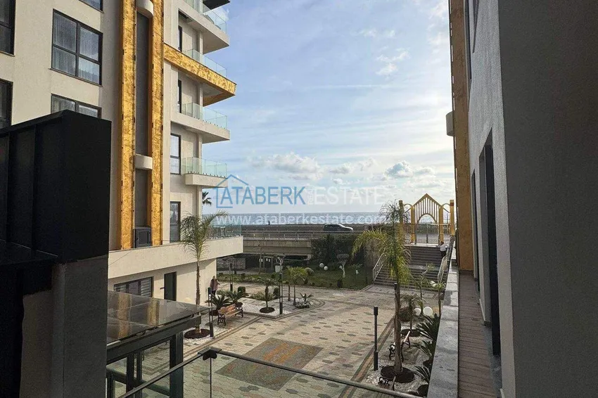 Purchase Apartment 1+1 on the first line in Mahmutlar — furnished and with sea views in a five-star hotel-level complex 10 