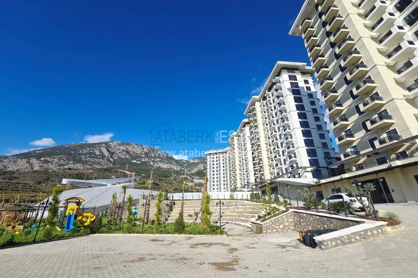 1+1 apartment with mountain views in Mahmutlar - a new residential complex with a transfer to the sea 17 
