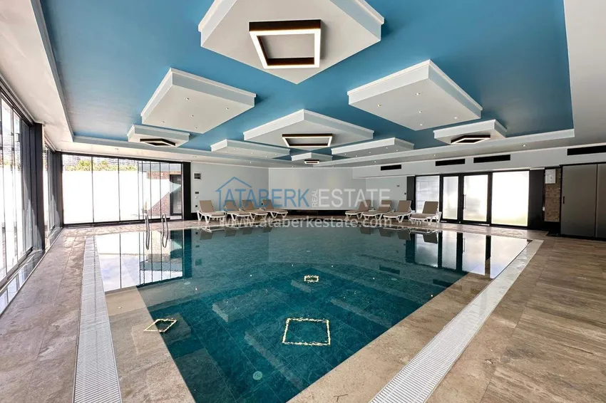 Finished two-bedroom apartment in a complex under completion in Mahmutlar 11 