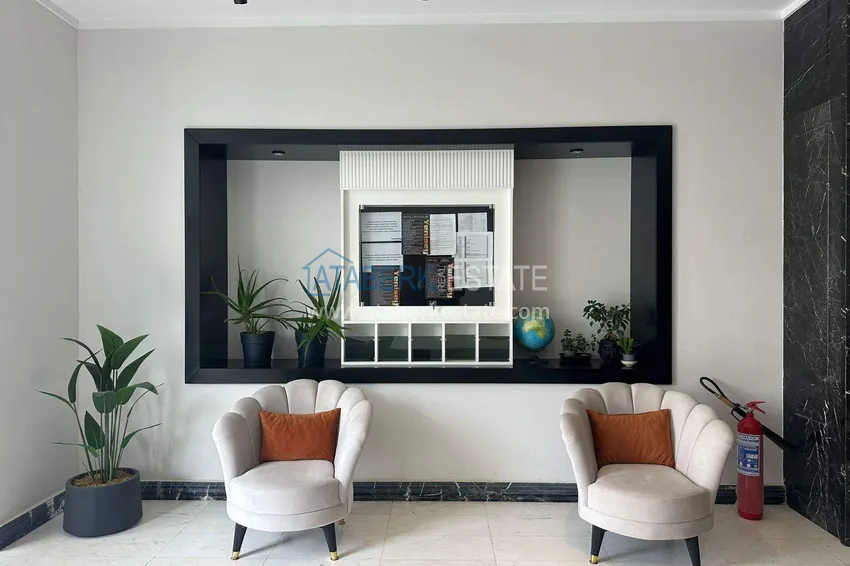 Finished two-bedroom apartment in a complex under completion in Mahmutlar 9 