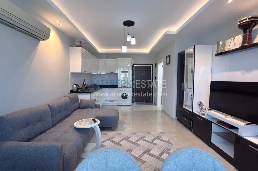 Purchase Apartment 1+1 in the center of Mahmutlar - on the 12th floor with furniture and mountain views 2 