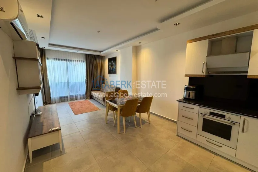 Purchase  One bedroom apartment with furniture and a glazed balcony in Mahmutlar, Alanya 5 
