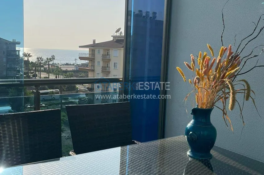 Purchase  1+1 apartment in Mahmutlar - furniture, glazed balcony, sea view, 200 m to the beach 15 