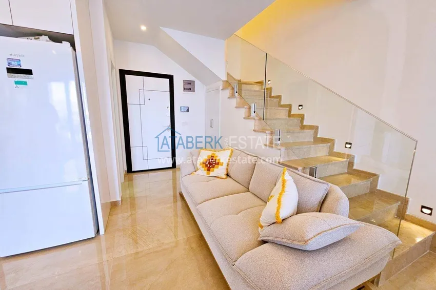 Purchase  2+1 penthouse duplex in Mahmutlar — furniture, sea and mountain views, complex with hotel-level service 1 