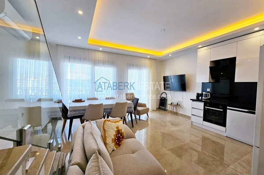 Purchase  2+1 penthouse duplex in Mahmutlar — furniture, sea and mountain views, complex with hotel-level service 2 