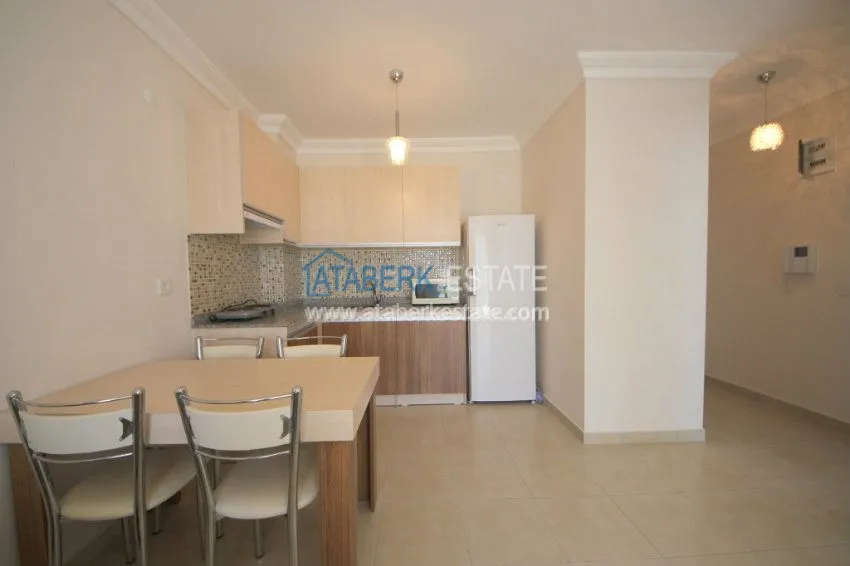 Purchase  Комфортабельные апартаменты 1+1 в центре района Махмутлар 12 