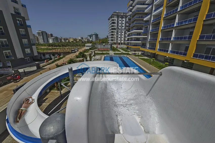 Трехкомнатная квартира в современном комплексе Махмутлара 16 