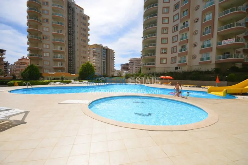 Меблированная двухкомнатная квартира в центре современного района Махмутлар.  8 