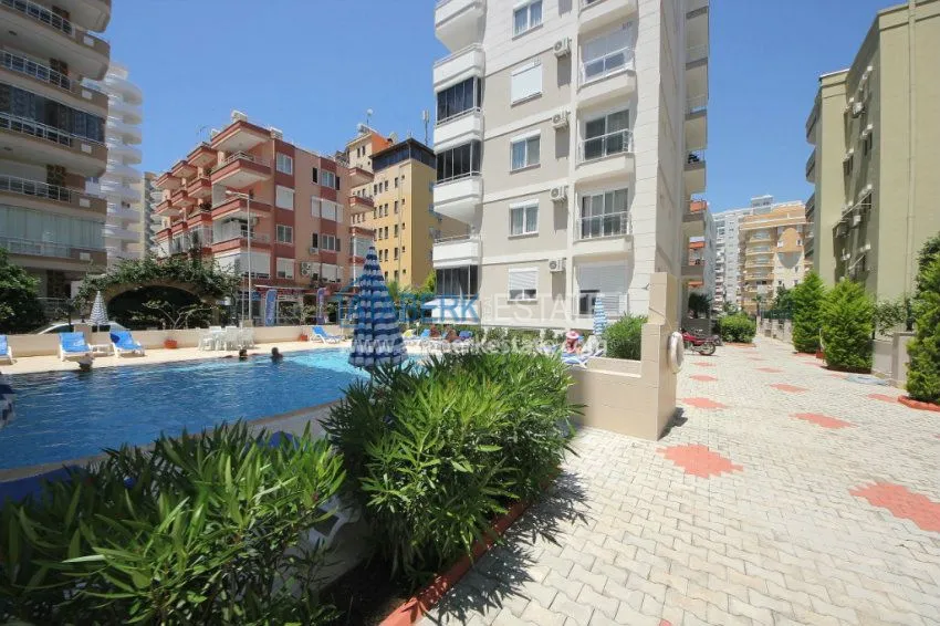 Комфортабельные апартаменты 1+1 в центре района Махмутлар 2 