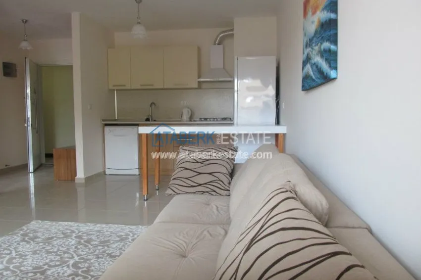 Меблированная двухкомнатная квартира в центре современного района Махмутлар.  14 