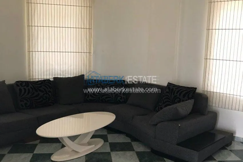 Меблированная двухкомнатная квартира в центре современного района Махмутлар.  17 