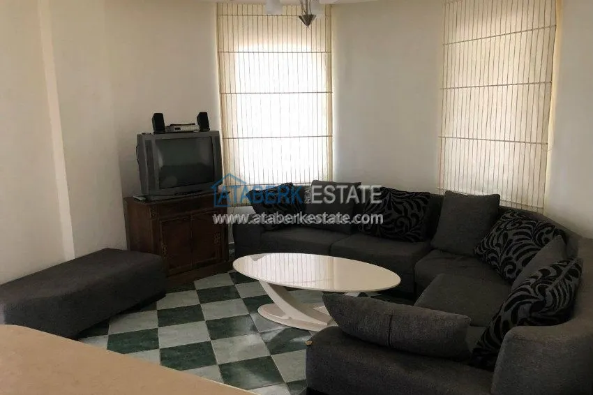 Меблированная двухкомнатная квартира в центре современного района Махмутлар.  19 