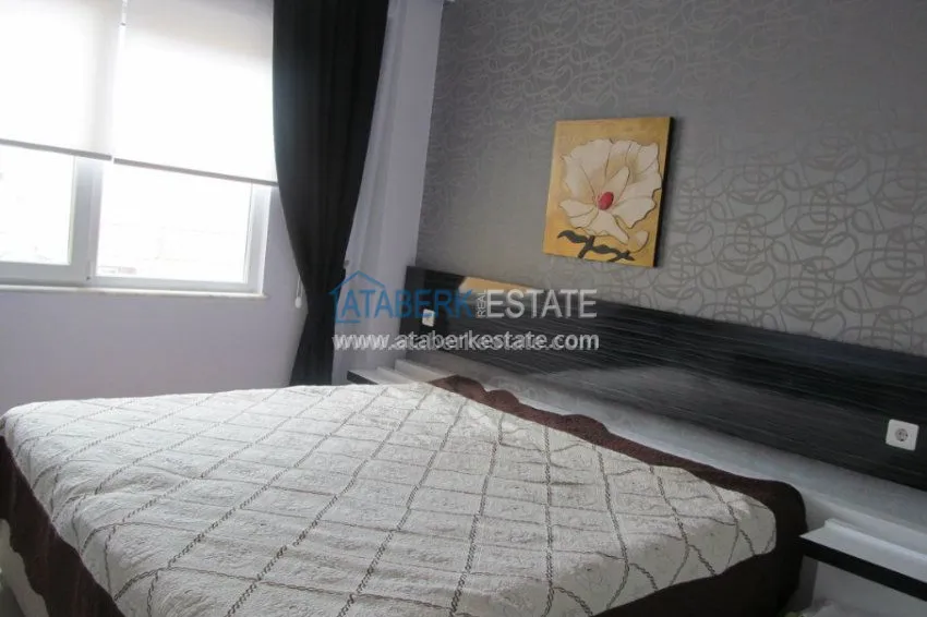 Меблированная двухкомнатная квартира в центре современного района Махмутлар.  21 