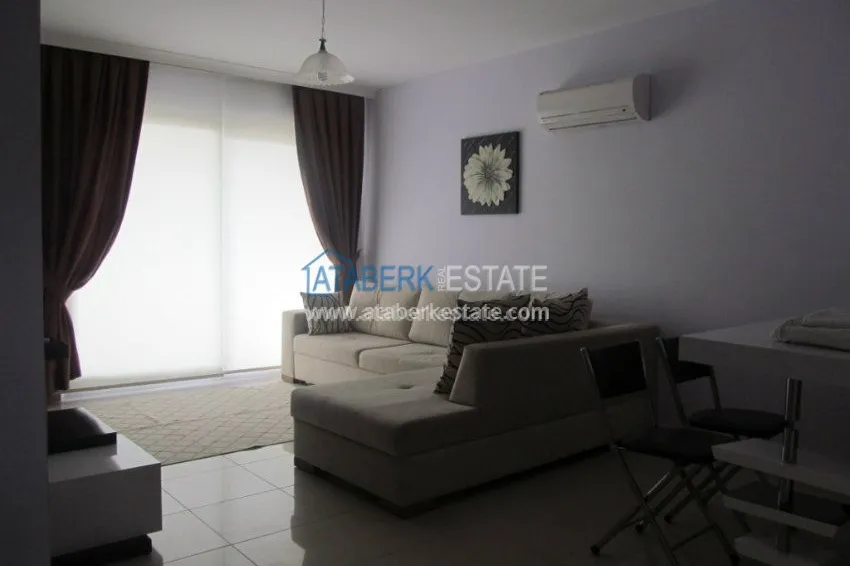 Меблированная двухкомнатная квартира в центре современного района Махмутлар.  22 