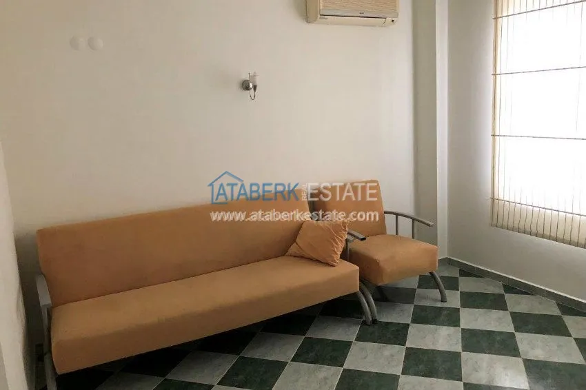 Меблированная двухкомнатная квартира в центре современного района Махмутлар.  23 