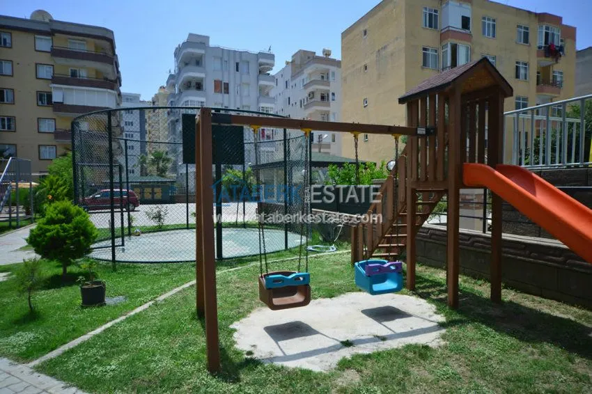 Апартаменты 1+1 в центре района Махмутлар 12 