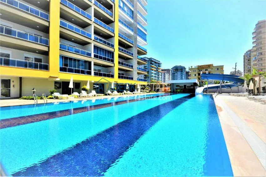 Трехкомнатная квартира в современном комплексе Махмутлара 25 