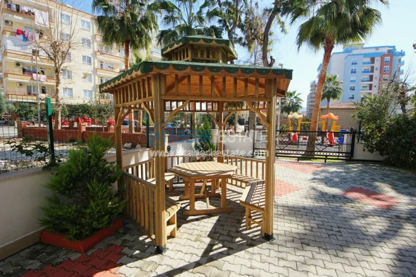 Комфортабельные апартаменты 1+1 в центре района Махмутлар 11 