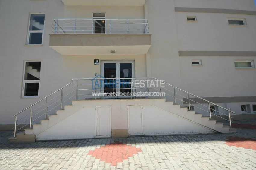 Комфортабельные апартаменты 1+1 в центре района Махмутлар 12 