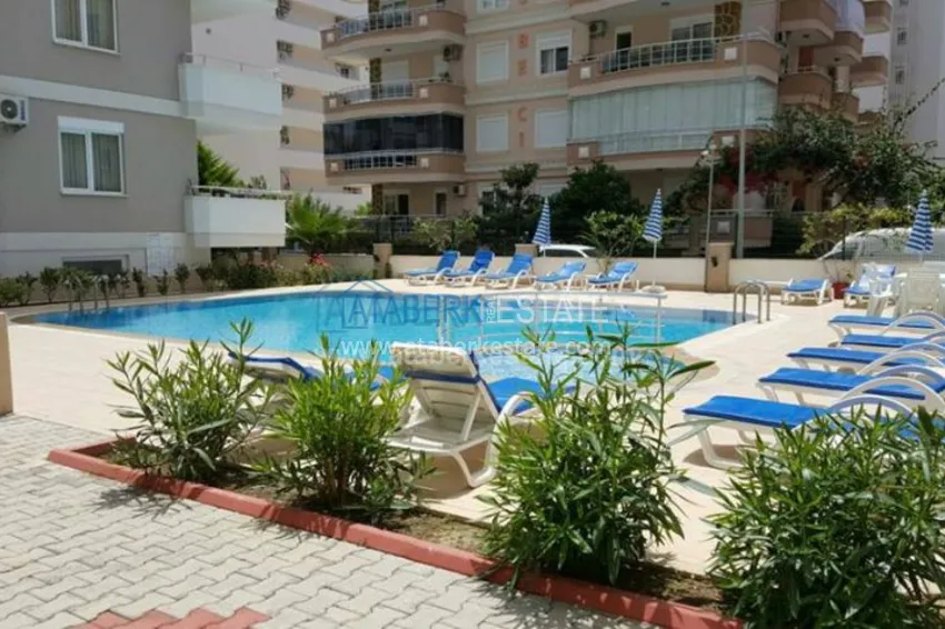 Комфортабельные апартаменты 1+1 в центре района Махмутлар 14 