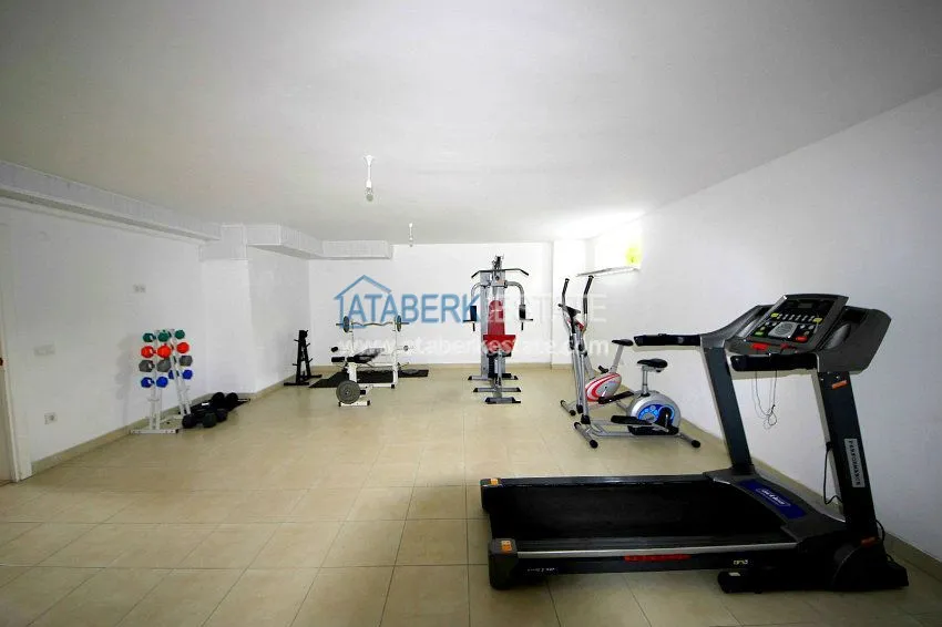 Комфортабельные апартаменты 1+1 в центре района Махмутлар 15 